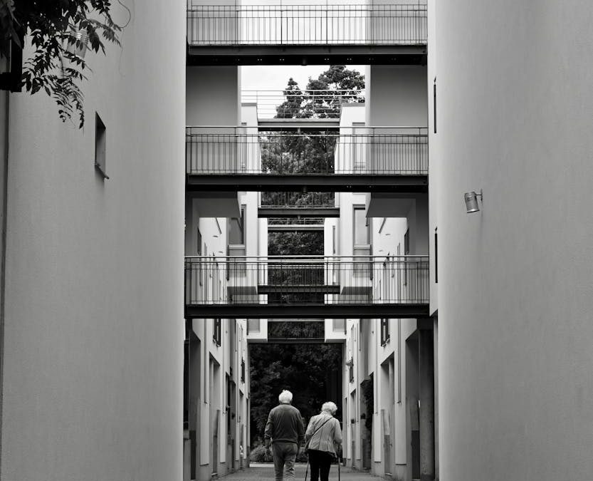 older couple strolling through modern architecture in hamburg