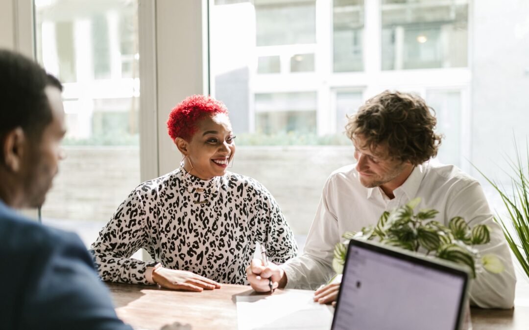 man in black and white long sleeve shirt sitting beside woman in white long sleeve shirt