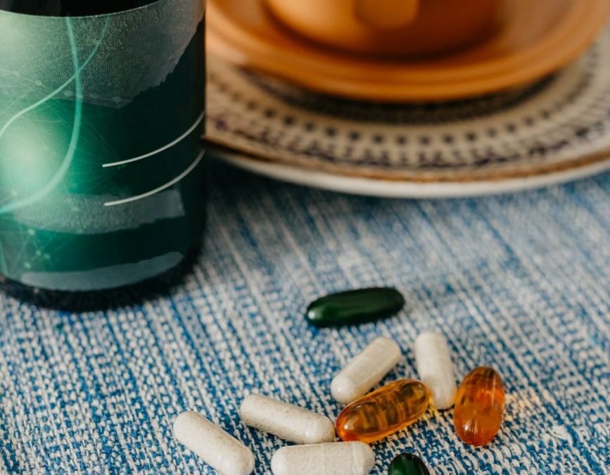 multi colored capsules lying on table